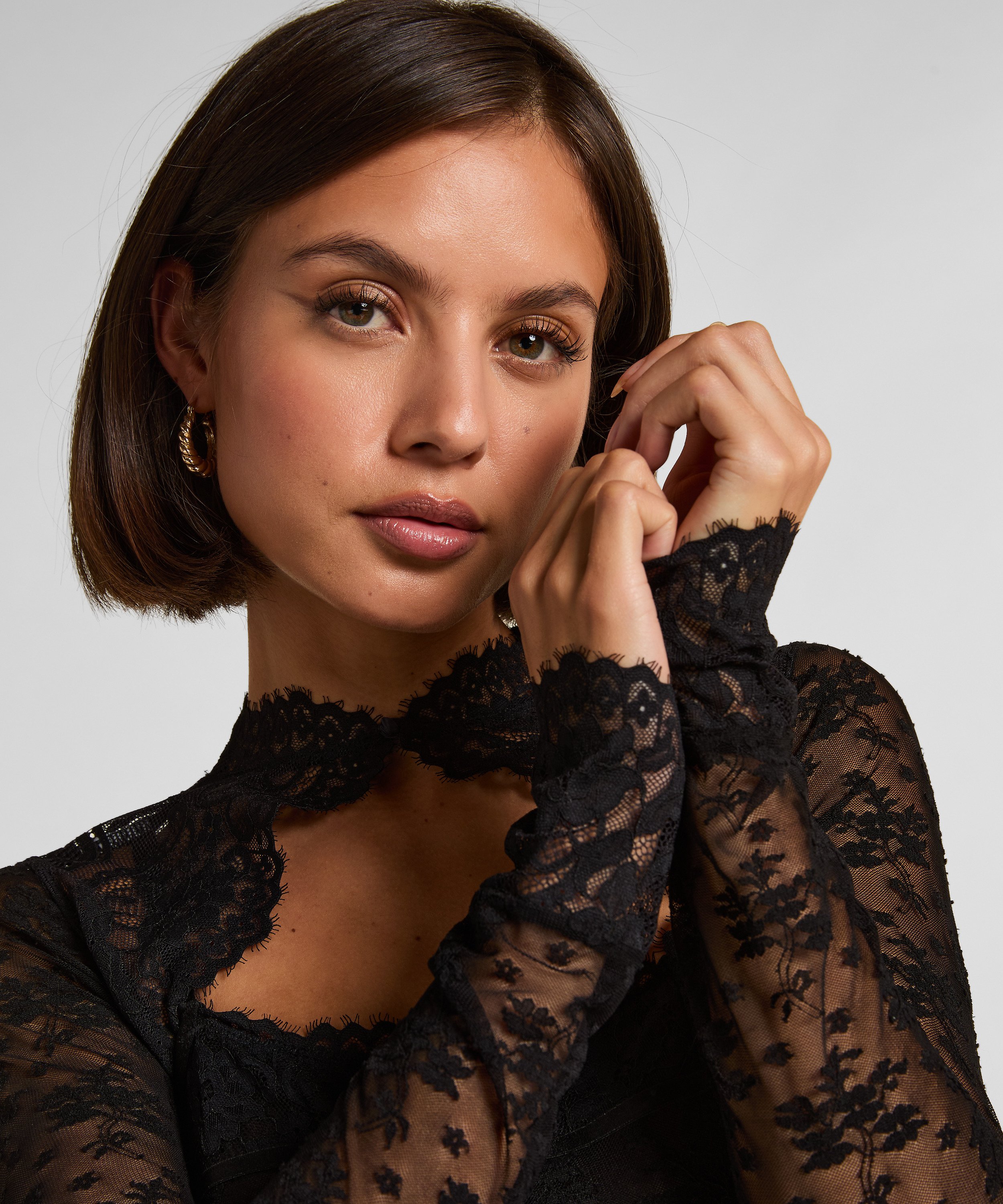 Turn heads with this stunning all-over lace body&mdash;where elegance meets versatility in one daring piece. Made from lace that hugs your curves, this body is designed to impress from every angle. The removable long sleeves offer the freedom to switch up your look. Perfect for special occasions, nights out, or adding a touch of luxury to your everyday wardrobe., Black, main